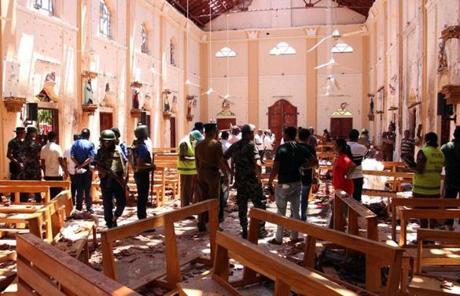 Sri Lankan security personnel walked through debris following an explosion in St Sebastian?s Church in Negombo, north of the capital Colombo. A series of blasts near at churches and hotels rocked the country Easter morning.
